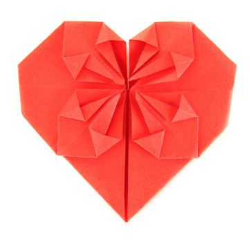 Origami paper heart isolated on white.