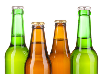 Coloured glass beer bottles isolated on white