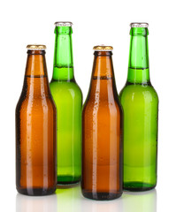 Coloured glass beer bottles isolated on white