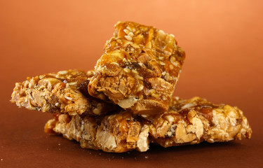 tasty sweets (kozinaki), on brown background