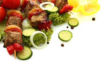 tasty grilled meat and vegetables on skewers, isolated on white