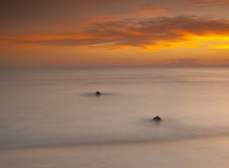 Obraz premium Beautiful sunset over an ocean