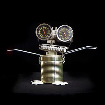 cute funny robot toy made of garbage. recycling waste