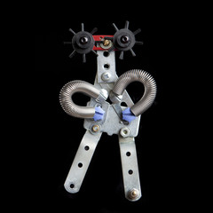 cute funny robot toy made of garbage. recycling waste