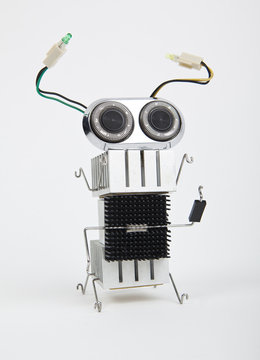 cute funny robot toy made of garbage. recycling waste