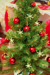 Fototapeta na wymiar Decorated Christmas and New Year tree indoors