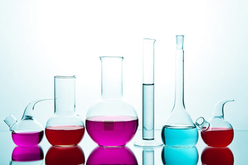 laboratory glassware with colorful chemicals