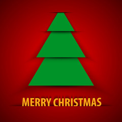 Green paper Christmas tree on red background