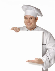 Cocinero chef sujetando una pancarta blanca.