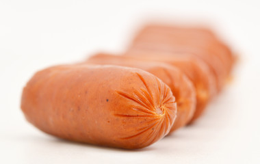 Little sausages isolated on white background