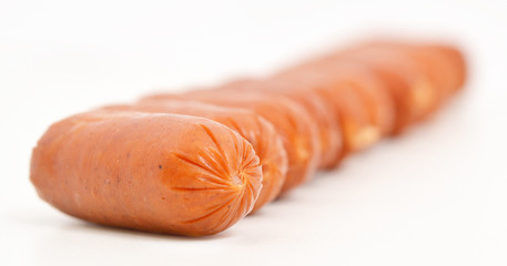 Little sausages isolated on white background