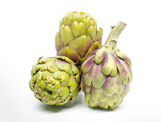 Obraz premium Three whole artichoke isolated on white background.