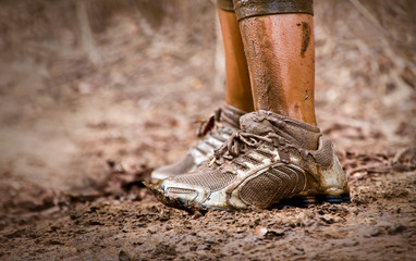 Mud race runner's muddy feet