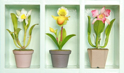 Naklejka na ściany i meble Clay flower in white flower cabinet