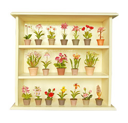 Clay flower in white flower cabinet