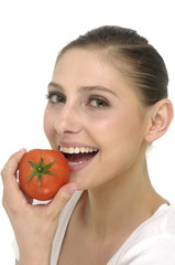 young woman with ripe tomato