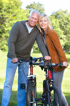 Happy senior couple cyclist.