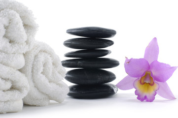 spa concept with pink orchid ,towel and stacked of stones