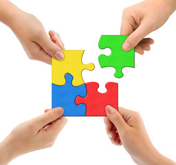 Hands and puzzle Team