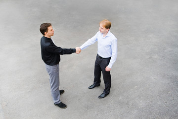 business partners concluded a bargain on the street