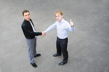 business partners concluded a bargain on the street