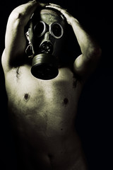 Panic, grunge portrait man in gas mask