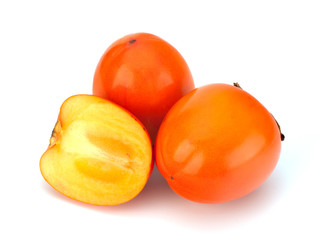 Cut persimmon isolated on white