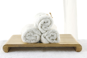 Three rolled white towel