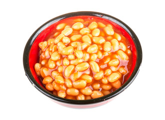 Marinated haricot beans in tomato sauce with shallots on a plate