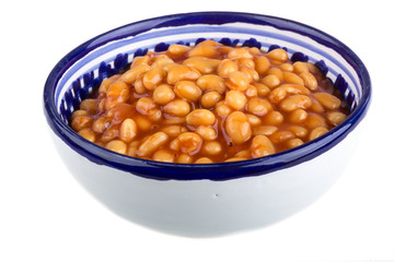 Marinated haricot beans in tomato sauce with shallots on a plate