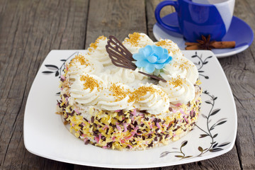 Cake and cup of coffee on vintage wooden boards