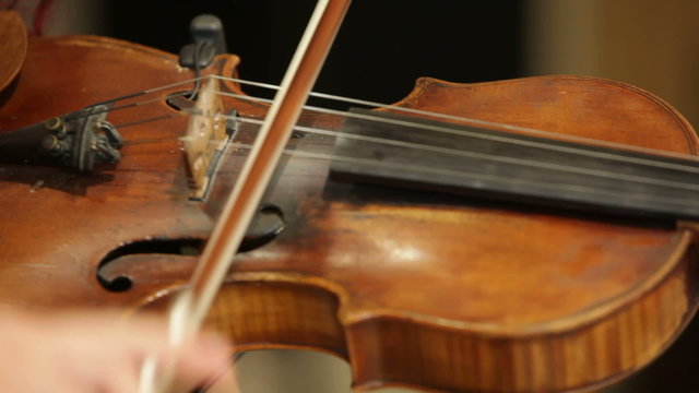 Young woman playing classical compositions on a violin