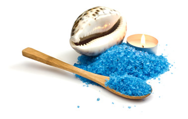 Sea salt witn candle and seashell isolated on white