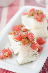 Baked cod with grapefruit salsa selective focus