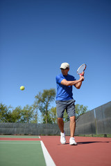 Tennis Payer retuning a ball