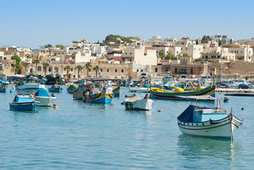 Fototapeta na wymiar Colorful traditional fishing boats in the island of Malta