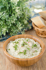Mashed potatoes and cabbage in a bowl on a wooden table