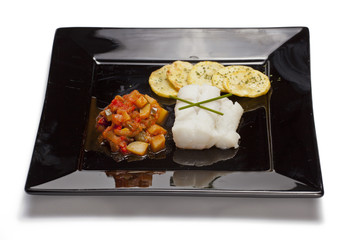 Fish dish with chips and vegetables