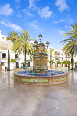 Fototapeta premium Beautiful and multi-colored fountain in a square, multi-tiered