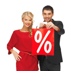 man and woman with shopping bag