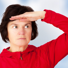 Woman holds open hand to his forehead