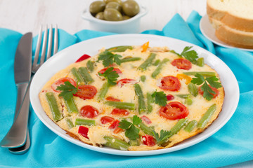 omelet with vegetables and bread
