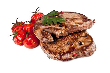 Delicious beef steaks isolated on white background
