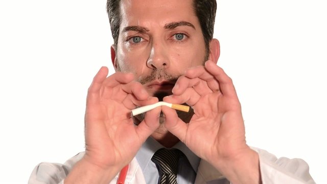 doctor breaking a cigarette