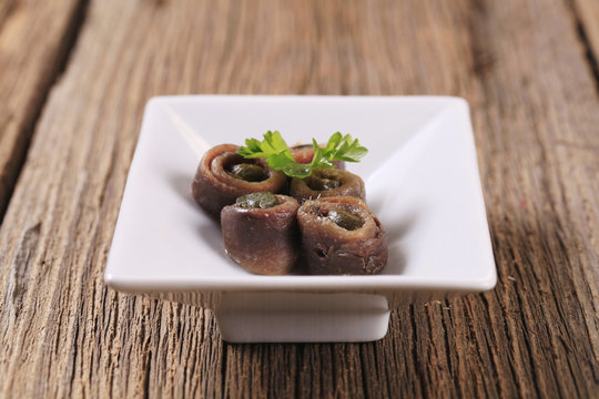 Salted anchovies with capers