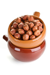 Peeled hazelnuts in a ceramic bowl