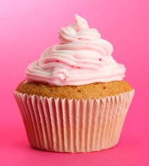 tasty cupcake, on pink background