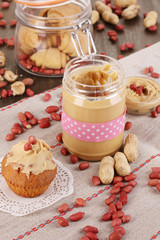 Fototapeta na wymiar Delicious peanut butter in jar with baking