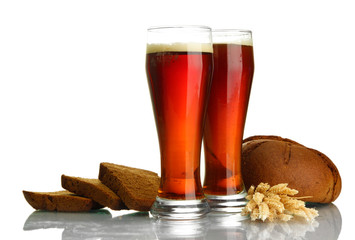 two glasses of kvass and rye breads with ears, isolated on