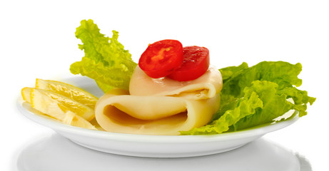 boiled squids with vegetables on the plate isolated on white